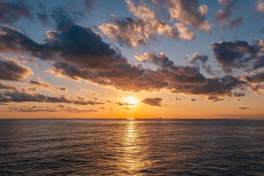Sunset over open water, photograph 12