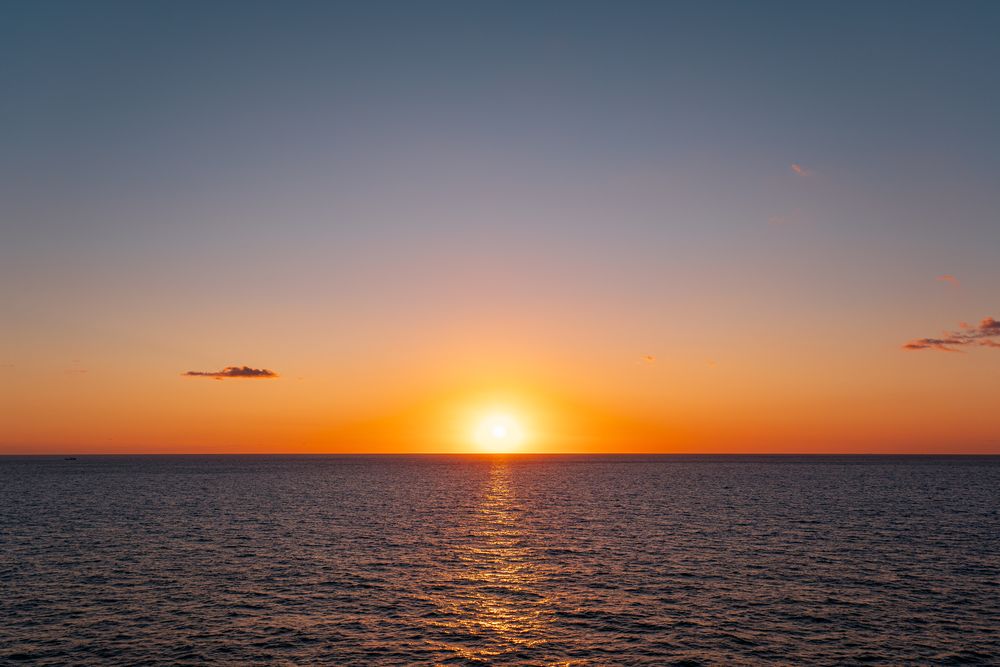 Sunset over open water, photograph 13