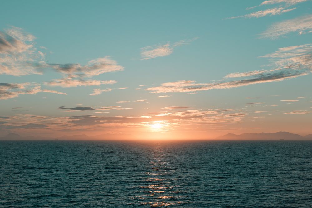 Sunset over open water, photograph 14