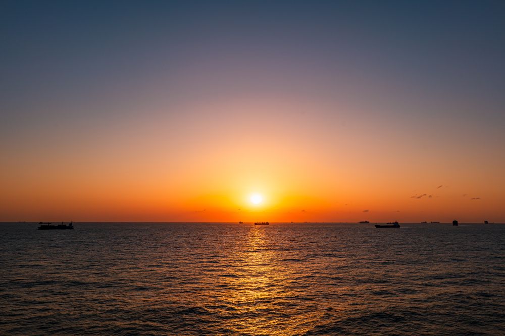 Sunset over open water, photograph 15