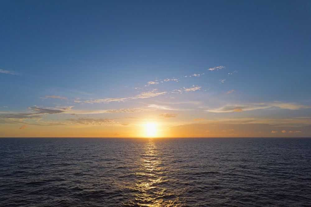 Sunset over open water, photograph 16