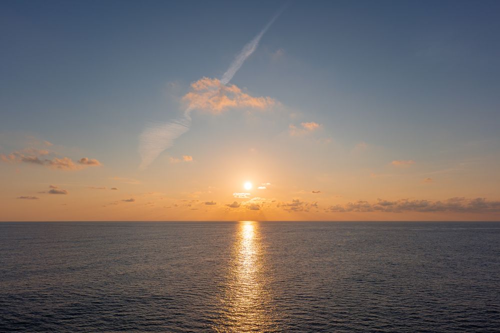 Sunset over open water, photograph 18